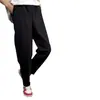 Calças casuais de outono espessadas forradas de lã Calças masculinas à prova de vento à prova de frio Calças de moletom quentes soltas plus size Calças forradas de lã de cor sólida