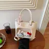 Bolso de Mano Pequeño Estilo Coreano 2026 Nuevo Bolso Cubo Sencillo para Mujer Alta Apariencia Bolso Cruzado Versátil