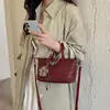 Bolso de mano tejido popular de nicho transfronterizo para mujer, nuevo modelo 2026, versátil, súper moderno, sensación de alta gama, bolso de hombro y cruzado