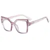 Gafas lisas de ojo de gato irregulares marco de resorte de PC anti luz azul color caramelo marco de gafas ópticas europeo y americano femenino