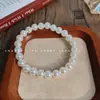 Pulsera elástica de perlas sintéticas simple retro francesa, moda de lujo ligero francés, para Instagram, diaria, versátil, elegante, joya para la mano
