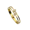Pulsera de Acero Inoxidable Asimétrica Dorada Abrible con Corazón Incrustado de Diamantes Amor Eterno de Moda Transfronteriza Europea y Americana para Mujer