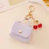 Porta-moedas vintage portátil com monograma, estojo para fones de ouvido, pingente, chaveiro, acessório estilo Miu, acessório de armazenamento