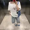 Camiseta Curta de Manga Meia-Manga Assimétrica para Mulheres, Novo Estilo Verão 2026, Emagrecedora, Sensação Preguiçosa e Relaxada, Top de Manga Meia-Manga, Estilo Puro Desejo