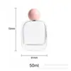 Venta directa de fábrica botella de perfume de vidrio de 50 ml, botella con atomizador de alto valor estético, 15 botellas de perfume vacías con clip