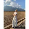 Jeans para mujer de diseño retro americano de alta costura 2026, lavados en blanco, tiro alto, corte curvo, pantalones anchos holgados de nicho