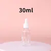Botella gotero Xinmei de vidrio transparente para aceites esenciales, botella vacía para dispensar esencia, admite personalización en múltiples especificaciones