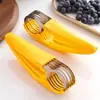 Rebanador de plátano, Pinza para salchicha de jamón, Divisor de frutas, Cortador multifuncional creativo, Herramienta para cortar melón, Gadget de cocina