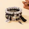 Pulsera con Colgante de Borla de Ala Redonda Estilo Bohemio Transfronterizo Europeo y Americano Pulsera de Cuerda Elástica Multicapa con Cuentas