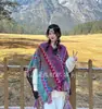 Venta al por mayor de fábrica chal de viaje estilo étnico capa de viaje chal bufanda para mujer Yunnan Xizang pradera foto protección solar