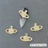 Al por mayor Joyería de Saturno de Aleación para Uñas Calientes Transfronteriza Decoración de Uñas Cruzada de Diamantes Planeta Oro y Plata