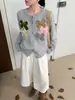 Elegante chaqueta suéter con lazo tridimensional, nuevo modelo otoño e invierno 2026, cárdigan de punto holgado de alta gama con cuello redondo para mujer