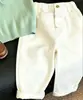 Estilo Coreano Camisa de Punto para Niños Verano 2026 Nueva Verde Bordado Hueco Cuello Polo Manga Corta Pantalones Casuales para Niños Modernos
