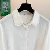 Foto real de camisa feminina rosa bordada de manga comprida, novo top bordado slim fit outono 2026, base de algodão puro