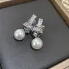Pendientes de Perla de Circonita de Moda de Aguja Plateada Pendientes de Botón Retro de Lujo Ligero de Nicho Francés Pendientes Nuevos 2026