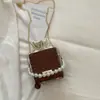 Bolso de Mano Casual con Cadena de Perlas y Cordón Texturizado y Elegante Modelo Nuevo 2026 Bolso Cruzado de Hombro Simple y de Moda con Forma de Caja