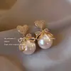 Pendientes de Perlas de Imitación Estilo Barroco de Gama Alta Pendientes de Diamantes Destellantes con Lazo de Nicho Lujo Accesible Pendientes Nuevo Estilo Caliente 2025