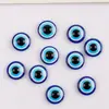 Venta al por mayor de fábrica resina ojo azul oblea Ojo Turco del Diablo ojo azul cuenta plana azul accesorios para ropa