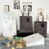 Cuerda de Papel Bolsa de Regalo Cuerda Mediana Bronceado Ins Dibujos Animados Bolsa de Compras Linda Exquisita Bolsa de Papel Kraft Al Por Mayor