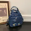 Bolso de Mezclilla Bordado Estilo Japonés para Mujer 2026 Verano Nueva Moda Mochila Personalizada Casual Bolso Cruzado de Hombro