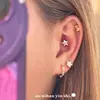 Pendientes de botón de estrella de cinco puntas con incrustaciones de diamante de plata de ley S925 Ou Ni Han para mujer Moda de alta gama Estilo Ins Tachuelas de hueso de oreja de estrella de circón