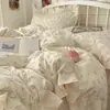 Juego de cuatro piezas floral 100% algodón Clase A, ropa de cama de algodón lavado, funda de edredón de encaje estilo coreano, funda de edredón y sábana de algodón puro