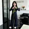 Conjunto de otoño para niña 2026 nuevo elegante top tipo chal de alta gama para niños y pantalones de trabajo de primavera/otoño conjunto de dos piezas