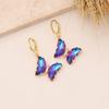 Pendientes de mariposa con degradado personalizado, joyería transfronteriza europea y americana, pendientes de temperamento de moda, pendientes ligeros de lujo de oro de 18 quilates E421