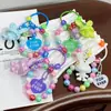Nuevo Llavero Colgante de Conejo Acrílico Tridimensional Galvanizado Accesorios Pequeños Frescos de Colores con Cuentas Decoración para Cubierta de Auriculares