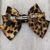 Horquilla con lazo de leopardo de alta calidad para mujer, elegante tocado de alta gama, con lazo de media horquilla y clip superior de primavera.