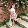 Conjunto de manga corta para niña, nuevo estilo verano 2026, falda pastel de verano estilo coreano, conjunto de dos piezas de moda, venta al por mayor
