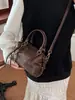 Bolso de mano tipo almohada de alta moda retro para mujer, nuevo estilo otoño e invierno 2026, bolso de hombro elegante, bolso cruzado versátil para el día a día