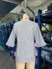 Ropa de mujer nueva de verano 2026 transfronteriza europea y americana Amazon blusa de manga media con botones rayada de volantes cuello en V