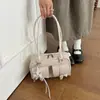 Bolso de mujer único de nicho estilo coreano, nuevo modelo primavera 2026, exquisito y elegante, bolso de hombro y bandolera simple y casual