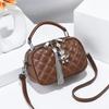 Lingge bolso pequeño para mujer 2024 nueva moda borla bolso redondo pequeño textura hombro portátil bandolera una generación de cabello