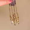 "Luz de Onda Espolvoreada" Pendientes Dorados de Industria Pesada con Borlas Largas 2024 Nuevo Pendientes Elegantes de Nicho con Sentido de Alta Gama para Mujer