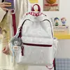 Nuevo modelo 2026 mochila casual estampada estilo ins para estudiantes de secundaria y primaria, mochila ligera de gran capacidad para ir a la escuela para niñas