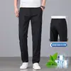 Pantalones casuales ligeros de lino de alta gama italianos, nuevos pantalones de seda helada rectos holgados elásticos para hombre de verano 2026