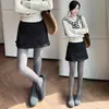 Falda corta de lana para mujer para otoño e invierno, falda de lana de línea A de cintura alta con pantalones cortos incorporados, minifalda súper elegante