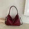 Bolso tote de color liso de gran capacidad, nuevo diseño de moda para principios de otoño de 2026, bolso de hombro nicho de alta apariencia para mujer