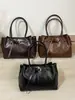 Bolso tote casual vintage para el trabajo y el día a día, nuevo y moderno para principios del otoño de 2026, de gran capacidad, simple, a la moda, bandolera personalizada
