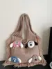 2025 Nuevo Bolso de Mujer Tejido Versátil de Hombro Único de Punto Popular de Comercio Exterior Otoño e Invierno con Bloques de Color Artísticos y Borlas