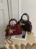 Bolso tipo Boston transfronterizo de nicho para mujer, nuevo bolso de hombro de moda 2026 con patrón de diamantes, bolso bandolera de cadena exquisito