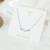Collar de amor sencillo de estilo japonés y coreano, cadena de clavícula con astas cruzadas, flor, perla y colgante de latido de corazón de celebridad cibernética.