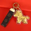Hazte Rico Inmediatamente Llavero de Oro Caricatura Zodiaco Llave de Coche Colgante Dorado Pareja Adorno Lindo Venta al por Mayor de Fábrica