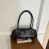 Bolso de axila retro francés de nicho para mujer, bolso baguette versátil de lujo ligero de principios de otoño, bolso de mano y bandolera para ir al trabajo