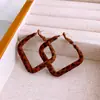 Pendientes Redondos de Rombos con Estampado de Leopardo en Tela de Aguja de Plata Pendientes Melard Retro Europeos y Americanos Pendientes de Nicho de Alta Gama Venta al por Mayor