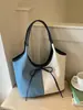 Bolso tote de gran capacidad para mujer, nuevo modelo de verano 2025, bolso simple casual para el hombro estilo ins, bolso versátil de moda para mujer