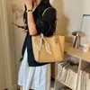 Bolsa Tote Grande Capacidade Feminina 2026 Novo Estilo Bolsa de Ombro Simples Nicho Versátil Diária Tecida Bolsa para o Trabalho