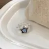 Anillo FANTAI con forma de estrella y perla sonriente para hombre y mujer, con apertura irregular en el dedo índice y estrella de la suerte azul.